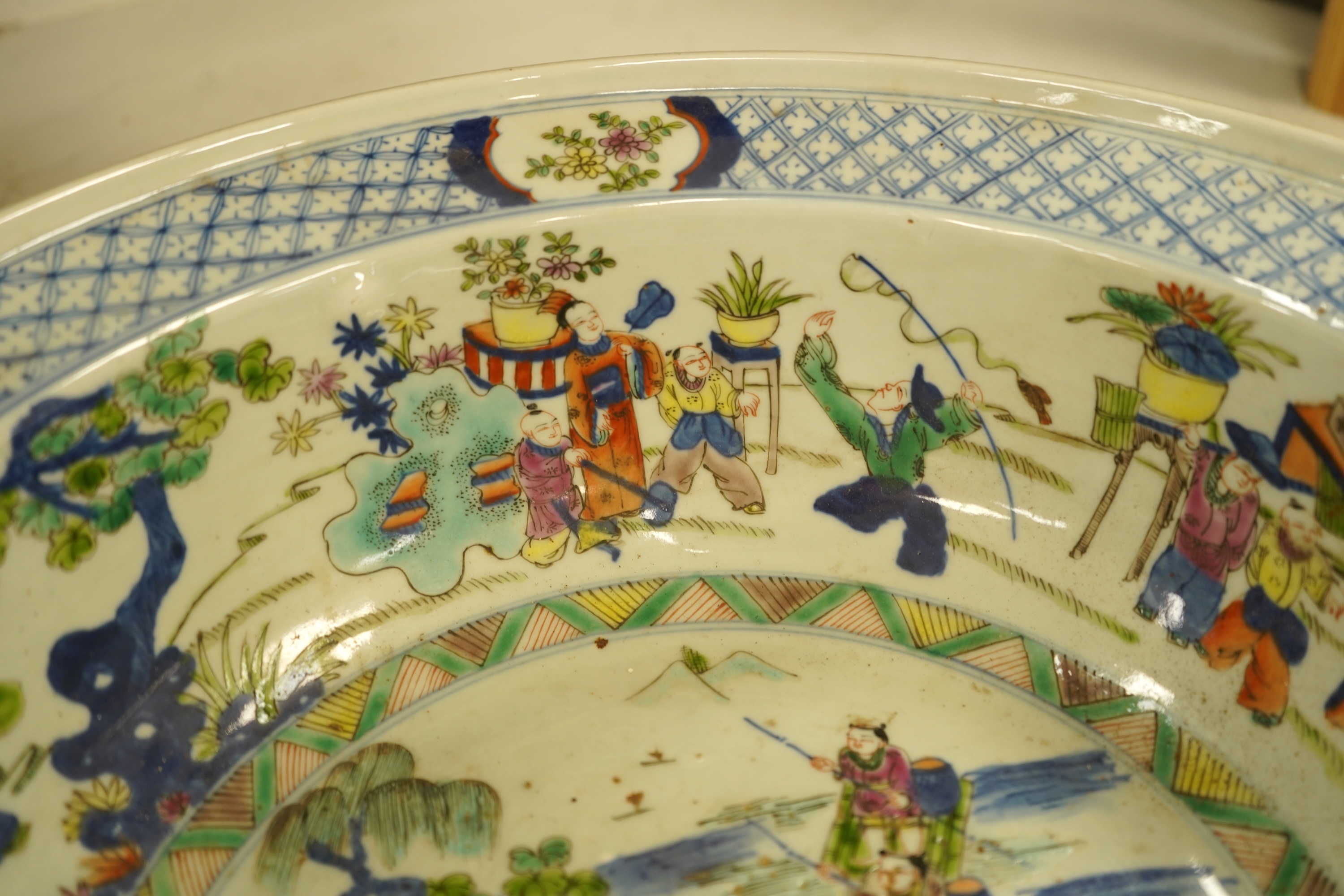 A large Chinese porcelain basin enamelled with figures, 41cm in diameter
